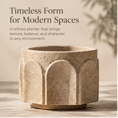 Beige arch relief planter styled with leafy greenery