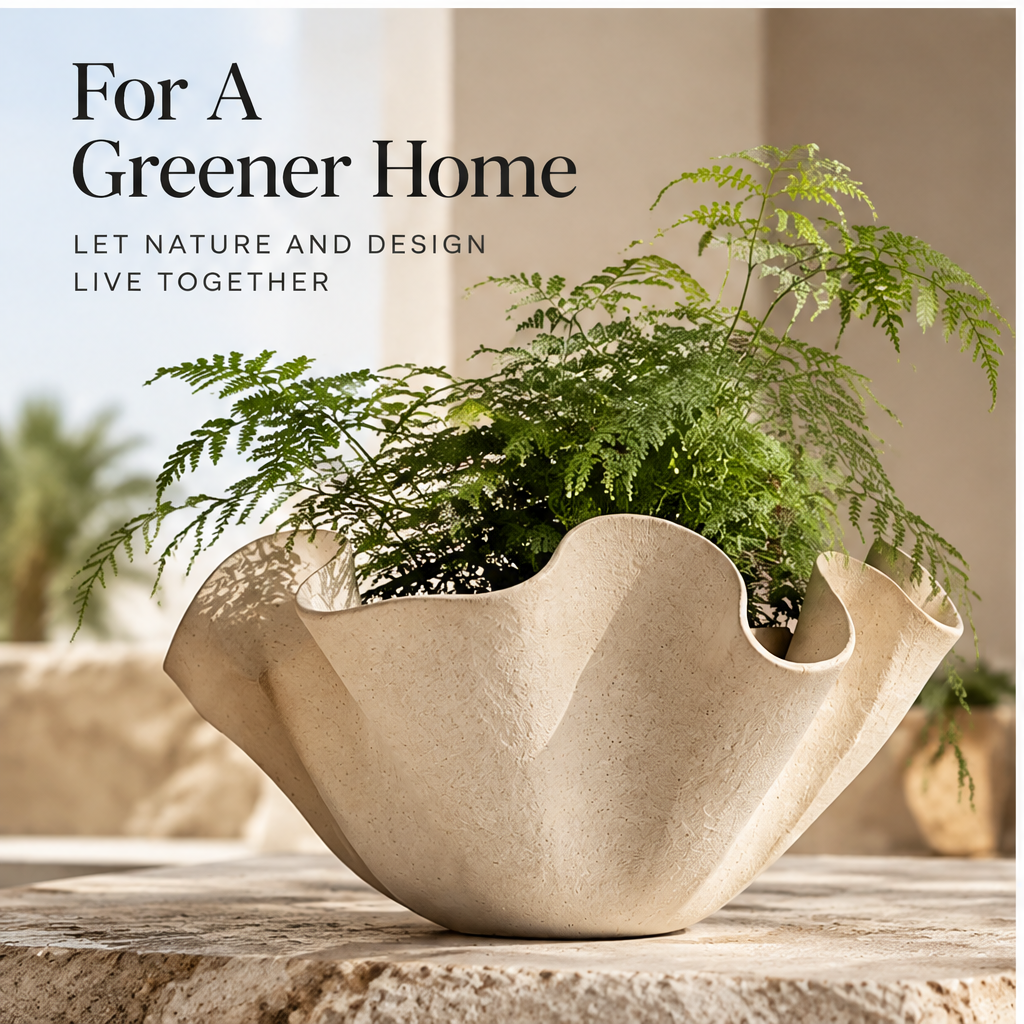 Cream sculptural planter styled with airy green foliage