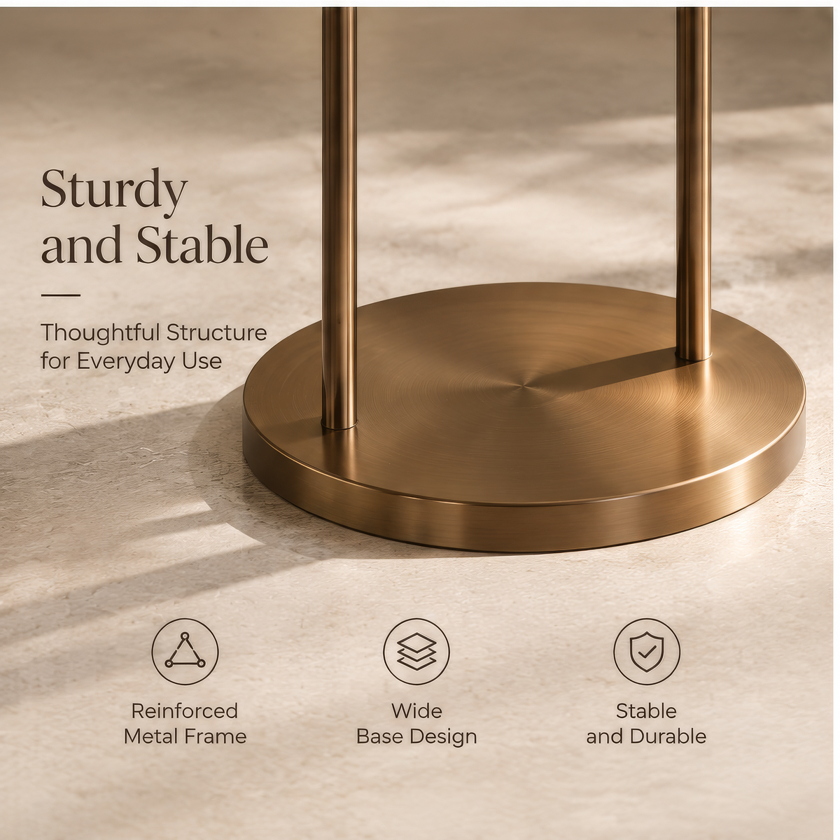 Gold-tone circular-frame plant stand styled with upright and trailing foliage