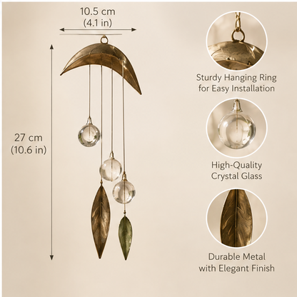 Glass sphere and leaf hanging decoration displayed in sunlight